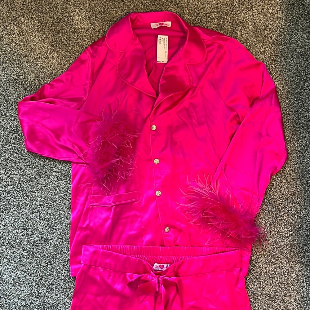 Pink silky pajamas with button-on feather cuffs